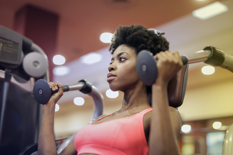 woman on fitness machine